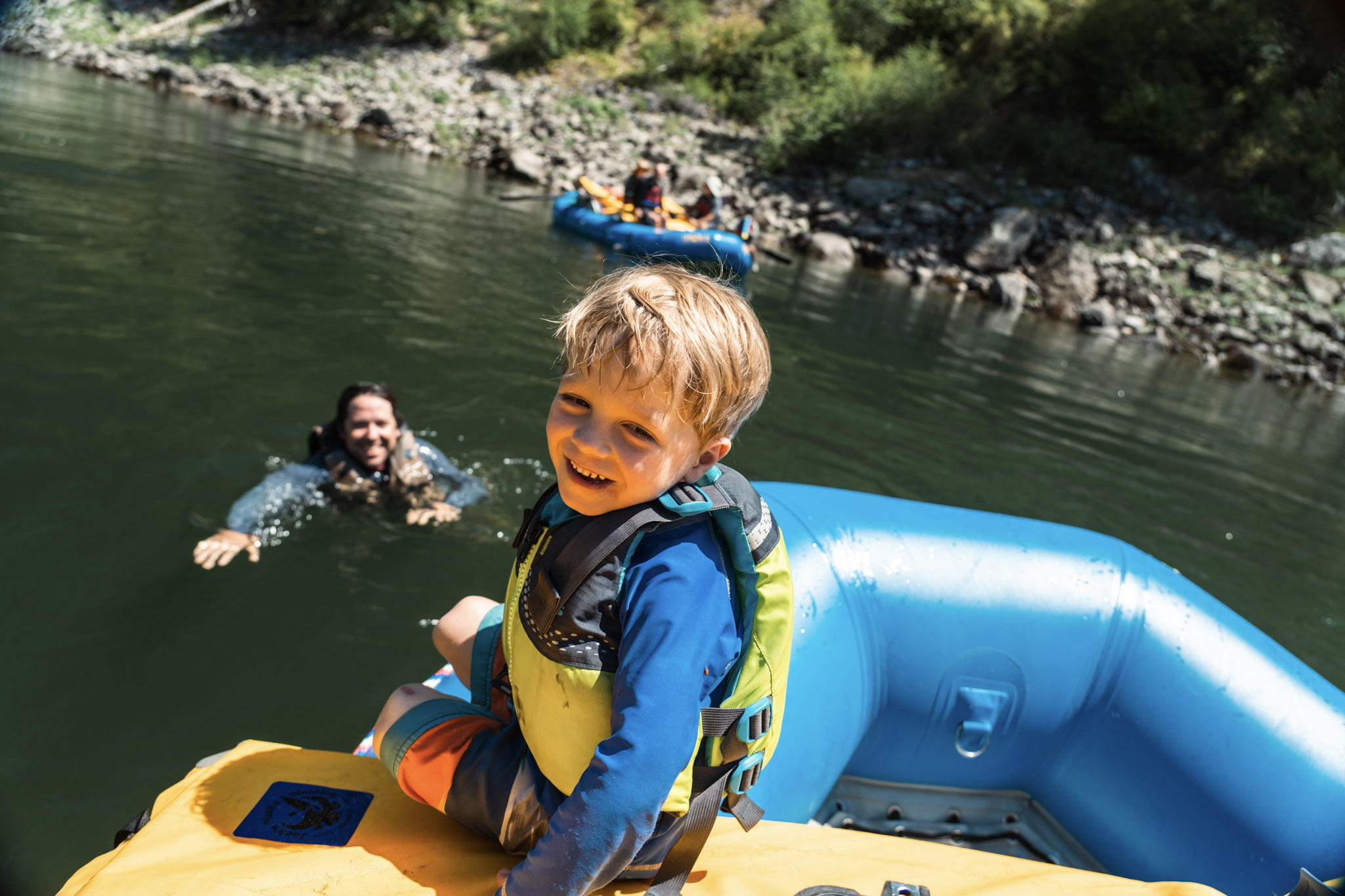 little boy smiling on a main salmon river rafting trip