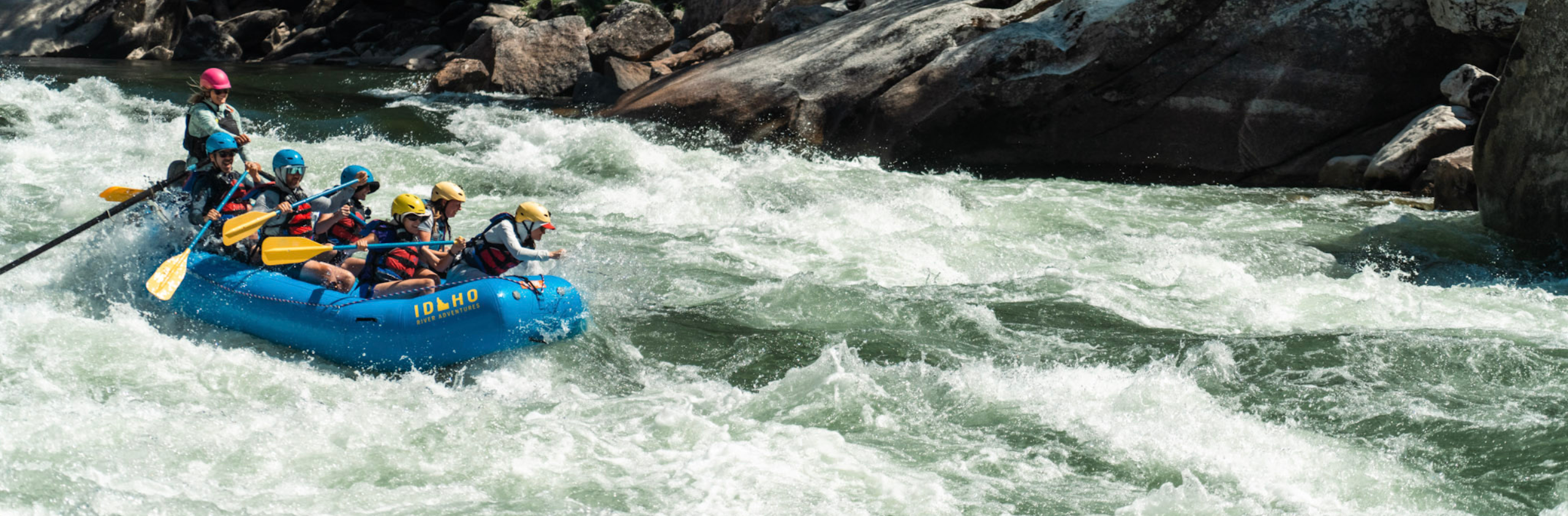 group of people going through a rapid on the main salmon river