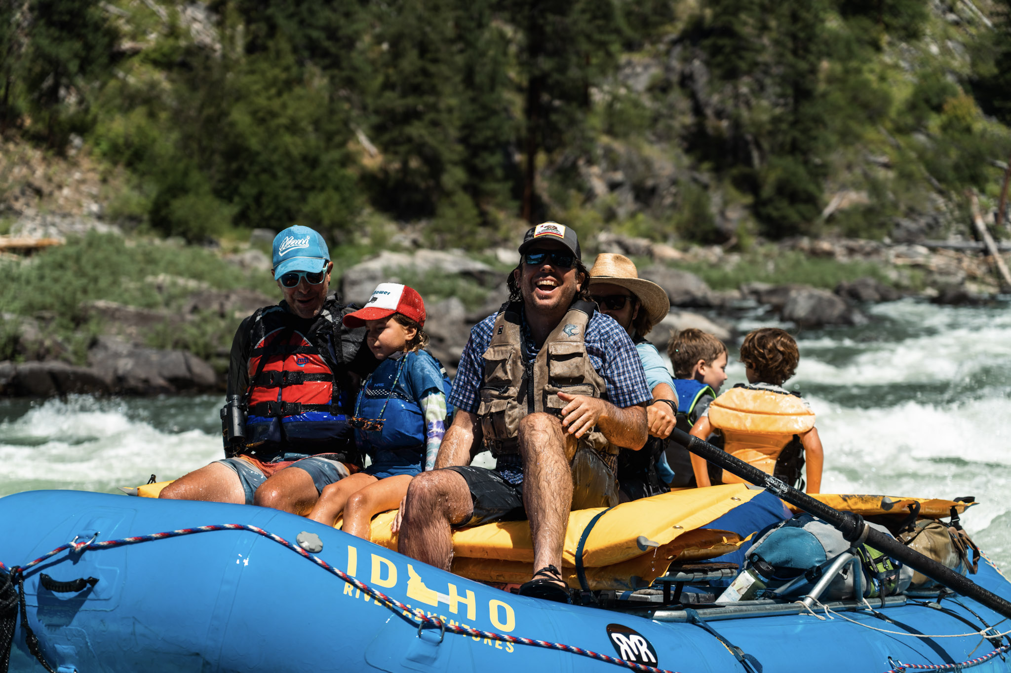 big smiles from people on raft going down the main salmon river